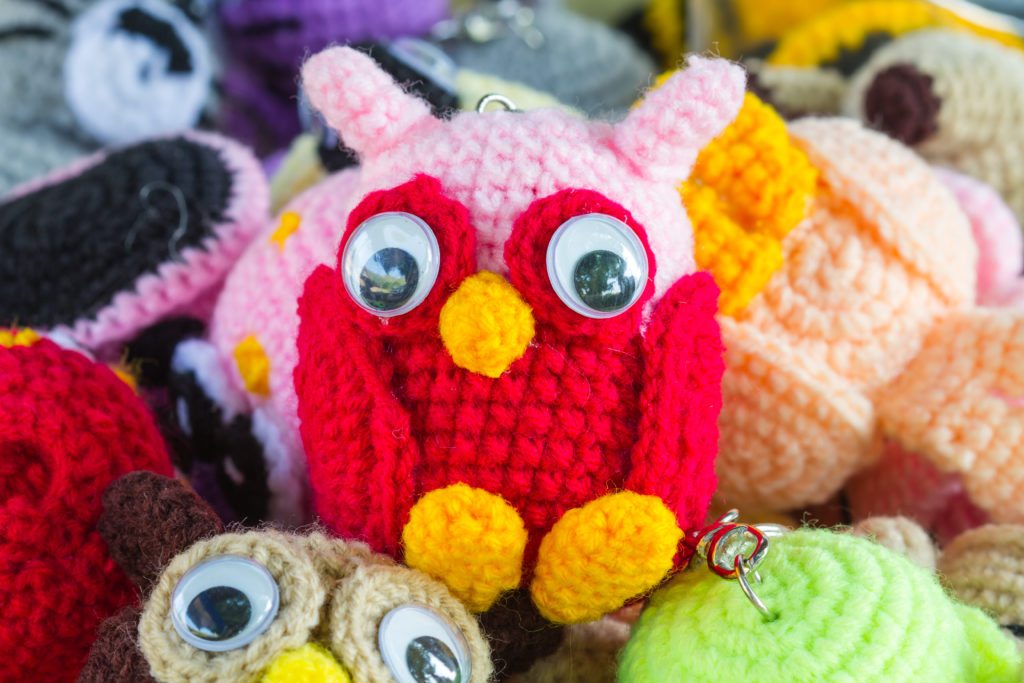 Crochet doll handmade art and crafts closeup, handmade crochet doll owl