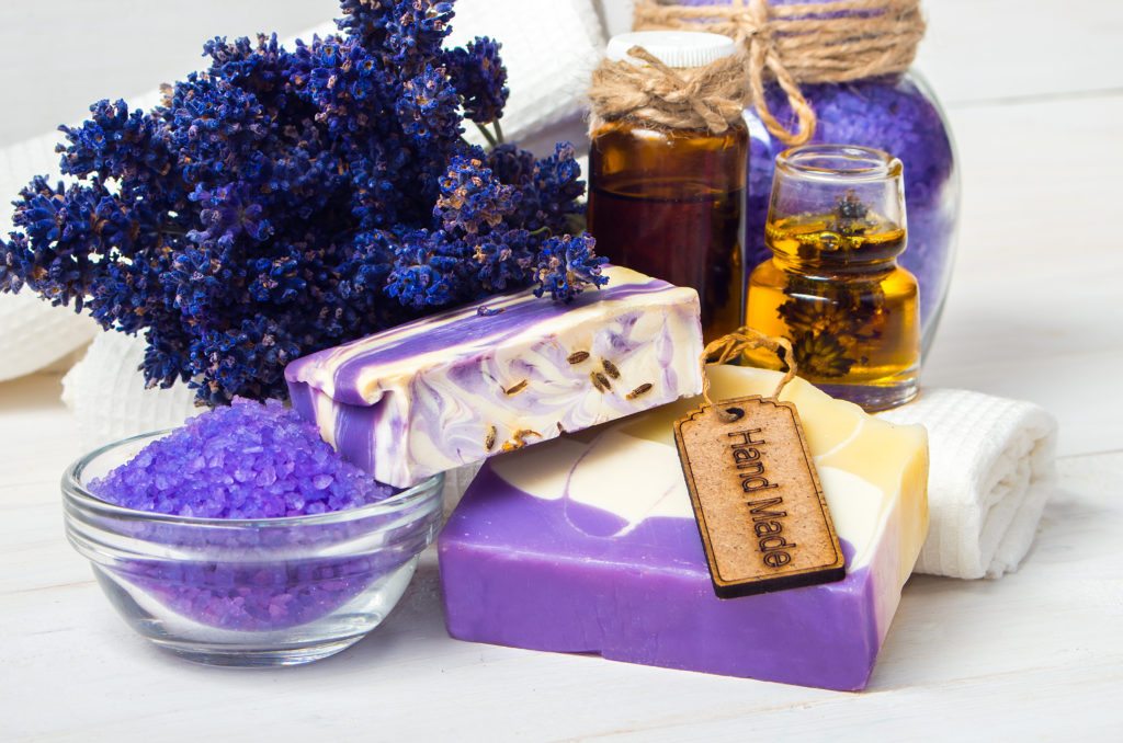 Spa concept. Lavender handmade soap and accessories for body care (lavender soap towel sponge sea salt)